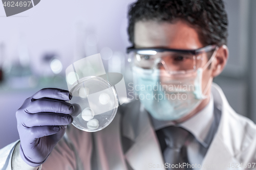 Image of Scientist working in corona virus vaccine development laboratory research facility.