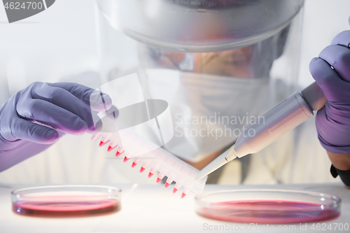 Image of Scientist working in the corona virus vaccine development laboratory research with a highest degree of protection gear.