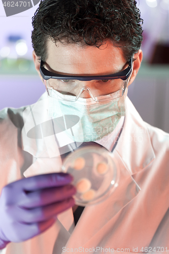 Image of Scientist working in corona virus vaccine development laboratory research facility.