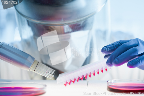 Image of Scientist working in the corona virus vaccine development laboratory research with a highest degree of protection gear.