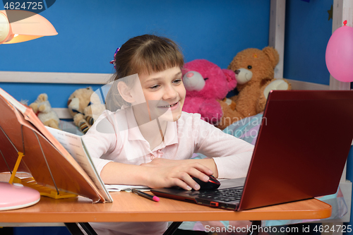 Image of Girl joyfully studying at school without leaving home