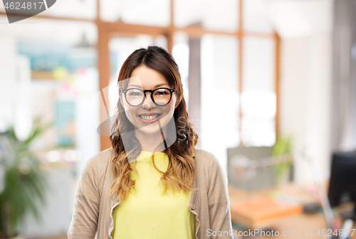 Image of happy asian woman in glasses or student