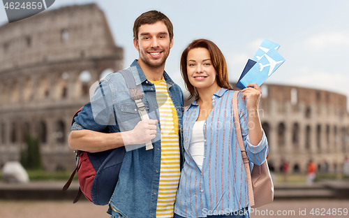 Image of happy couple with air tickets, bags and passport