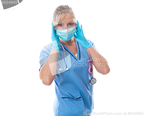 Image of Female nurse putting on protective medical mask PPE