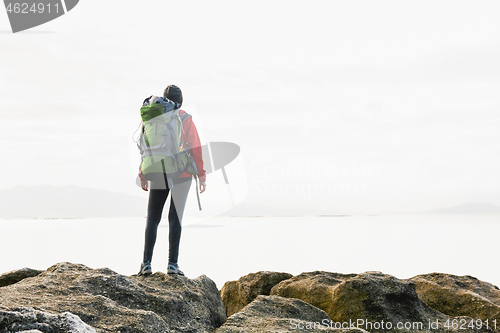 Image of Woman exploring the coast