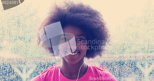 Image of portrait of young afro american woman in gym