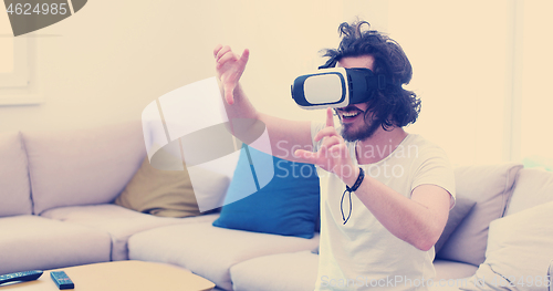 Image of man using VR-headset glasses of virtual reality