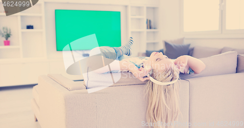 Image of girl enjoying music through headphones