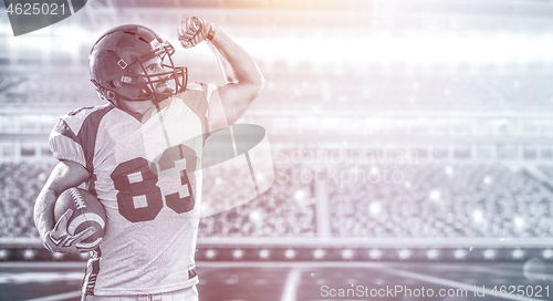 Image of american football player celebrating touchdown