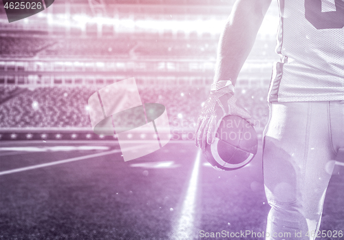 Image of closeup American Football Player isolated on big modern stadium