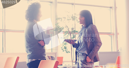 Image of Business People Working With Tablet in office