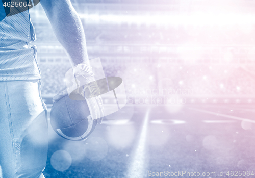 Image of closeup American Football Player isolated on big modern stadium