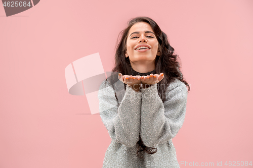 Image of Portrait of attractive cute girl with bright makeup with kiss and love sign isolated over pink background