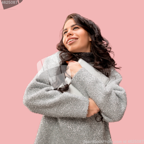 Image of Businesswoman hugging laptop. Love to computer concept.