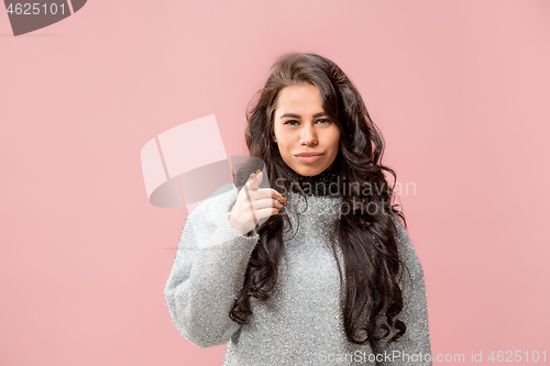 Image of The happy business woman point you and want you, half length closeup portrait on pink background.