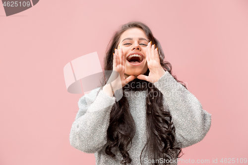 Image of Isolated on pink young casual woman shouting at studio