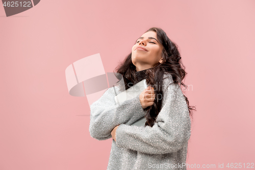 Image of Businesswoman hugging laptop. Love to computer concept.