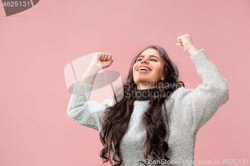 Image of Winning success woman happy ecstatic celebrating being a winner. Dynamic energetic image of female model