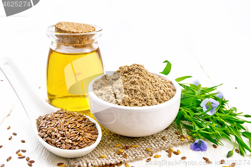 Image of Flour linen in bowl with seeds and oil on light board