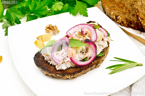 Image of Bruschetta with fish and curd in plate on white board