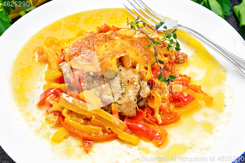 Image of Chicken with pepper in white plate on napkin