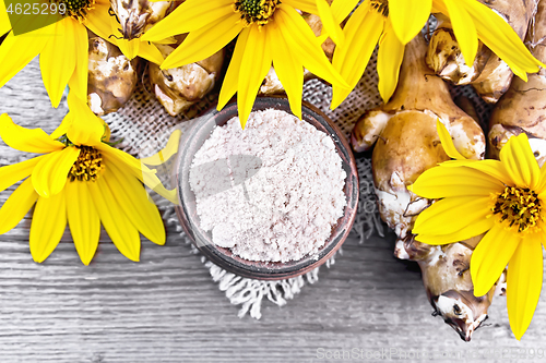Image of Flour of Jerusalem artichoke in bowl on board top