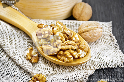 Image of Walnuts in spoon on board