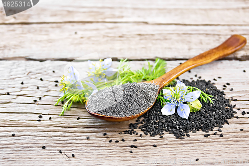 Image of Flour of kalingi in spoon with flower on old board