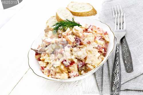 Image of Salad with chicken and vegetables in plate on white board