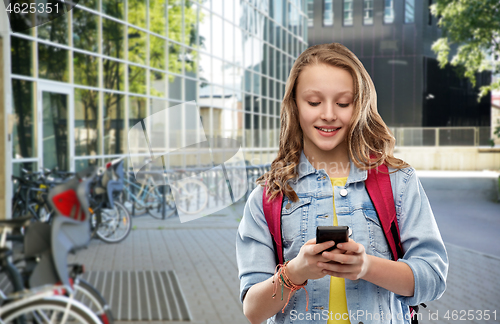 Image of teen student girl with school bag and smartphone