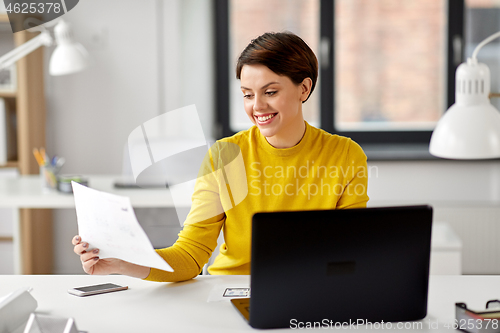 Image of creative woman working on user interface at office
