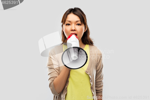 Image of asian woman speaking to megaphone