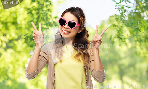 Image of asian woman in heart-shaped sunglasses