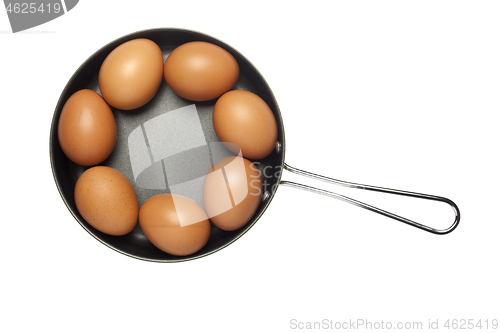 Image of Frying pan with seven eggs