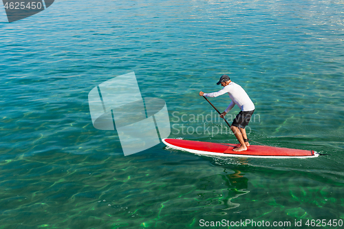 Image of Senior man practicing paddle