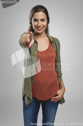 Image of Beautiful woman pointing 