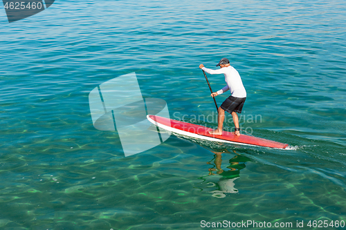 Image of Senior man practicing paddle