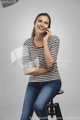 Image of Beautiful woman talking on phone