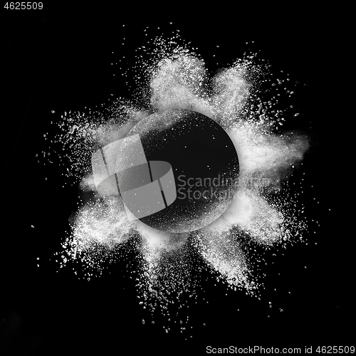 Image of White powder explosion in a round frame on a black background.