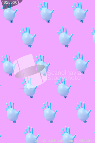 Image of Blue latex glove as balloons pattern on hot pink background.