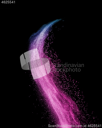Image of Colorful powder splash in purple colors on a black background.