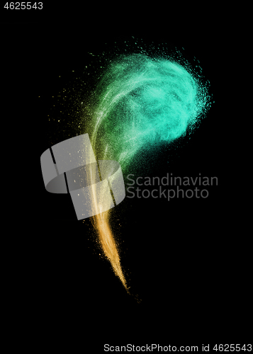 Image of Colorful creative wave powder or dust splash on a black background.