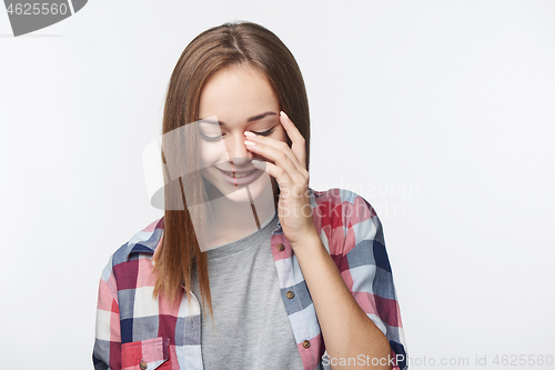 Image of Portrait of Teen girl laughing to tears