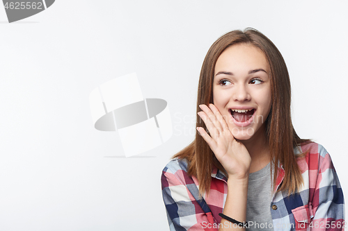 Image of Surprised teen girl looking to the side