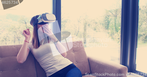 Image of woman using VR-headset glasses of virtual reality