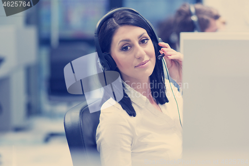 Image of female call centre operator doing her job