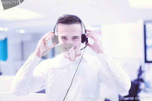 Image of male call centre operator doing his job