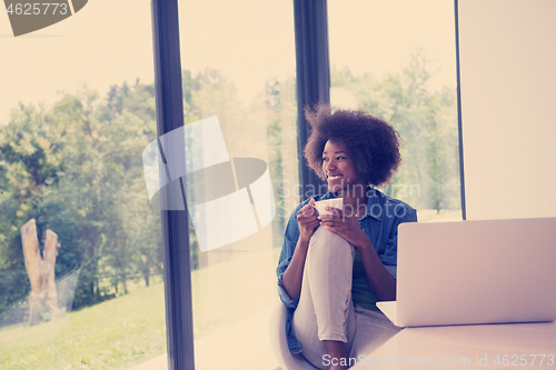 Image of African American woman in the living room