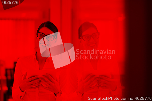 Image of Business Woman Using Digital Tablet in front of startup Office