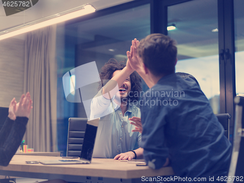 Image of startup Group of young business people celebrating success